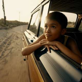 Boy looking out car window