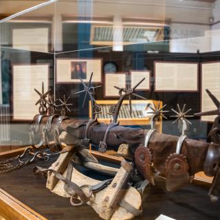 Close-up of a display of spurs in the Old Spanish Trail exhibit at the Animas Museum.