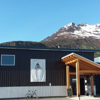 a brewery next to a mountain