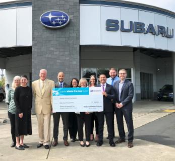 Renton-Schools-Foundation-Walker-Subaru-2022-Share-the-Love-donation-check