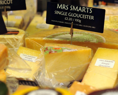 A close up shot of English cheeses, including Mrs Smarts Single Gloucester