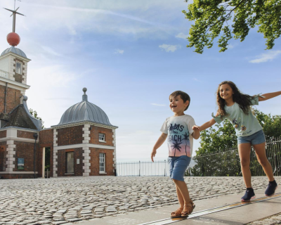 Two children walk the Meridian line in Greenwich