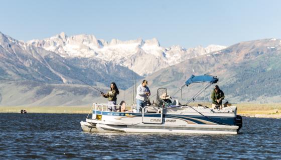 Pontoon boat on the Bridgeport Reservoir with a group fishing.