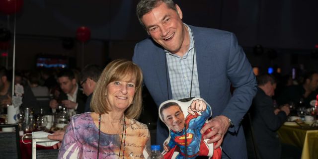 Bossin presented Shoppers Drug Mart president Jeff Leger with a superhero pillow