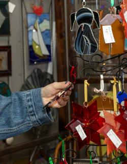 Picture of hand holding item in a gift shop