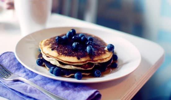 Pancakes topped with fresh blueberries