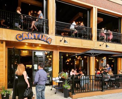 Front of Cantina restaurant with people dining at tables