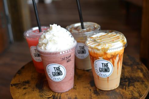 Group of assorted drinks, including smoothies and iced coffees, at The Grind Coffee Company