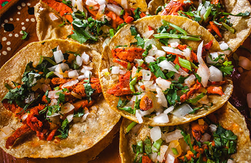 Al Pastor tacos with onion and cilantro