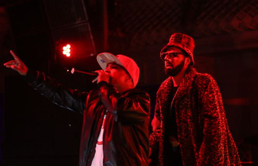 The two members of Digital Underground perform on stage