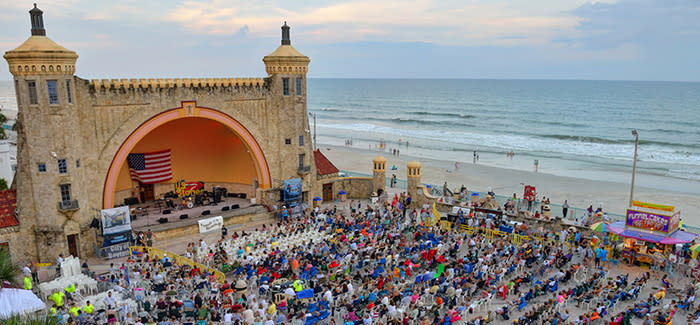 A view of a Bandshell summer concert before the sun sets.
