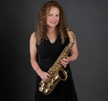 a woman holding a saxophone