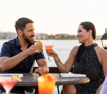 Couple enjoying outdoor dining at The Captain's Table in Punta Gorda/Englewood Beach