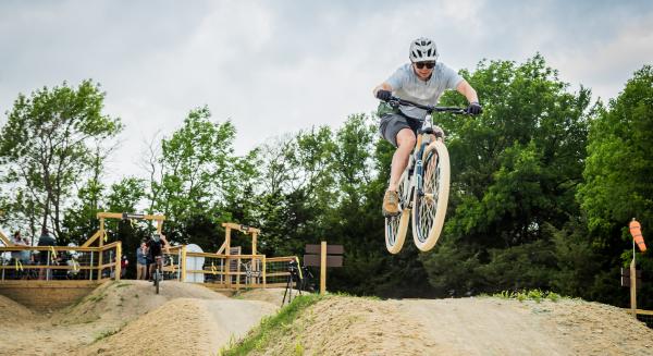 Erwin park skills area - cyclist jumping on dirt track