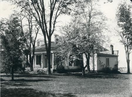 Hazelwood House Archive, house exterior with trees in the foreground. Black and white.