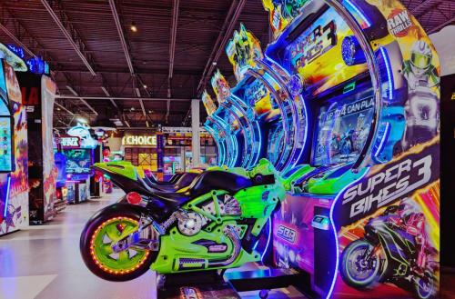 Main Event arcade games shown highlighted by multiple motorcycle games next to each other.