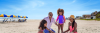 Family on beach making a sandcastle