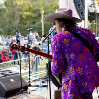 Guitarist performs for the crowd at Abita Fall Fest