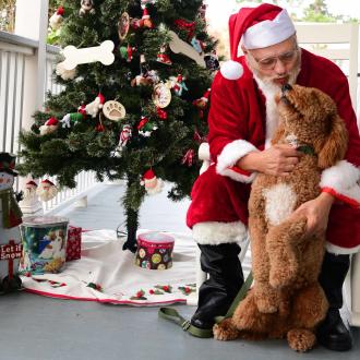 Shop Local Saturday in Old Mandeville with Santa and dog
