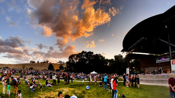 Concertgoers enjoy a performance in the evening cool at the Montrose Rotary Amphitheater