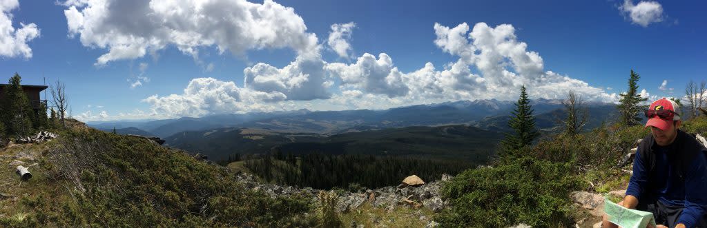 Hiker Looking at Map | Visit Big Sky