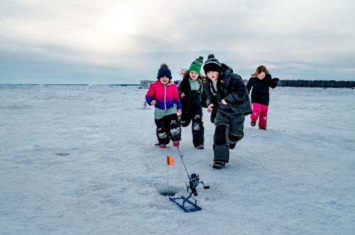 Children Running to a Tip Up Flag