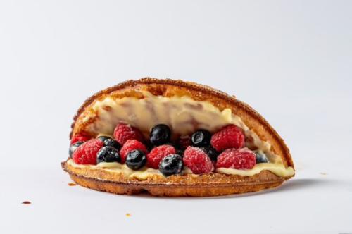 Waffle sandwich with cream and berries