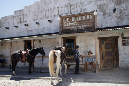 Horses and riders in front of the Buckhorn Saloon in Pinos Altos, NM