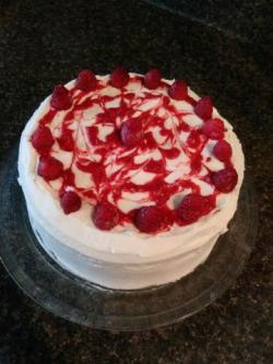 White cake with fresh raspberries