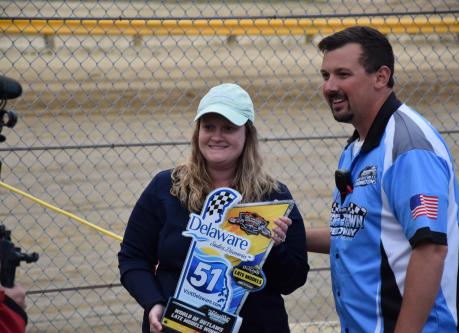 Tourism Director Jessica Welch posing with Georgetown Speedway staff member during an interview.