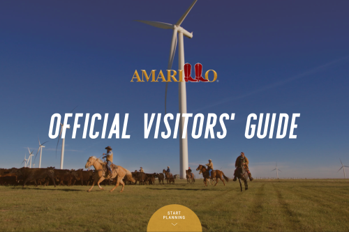 2021 Digital Visitor Guide Cover cowboys on horseback herding cattle with massive wind turbines in the distance