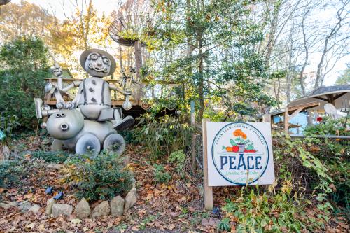 Picture of artwork and sign at Peace Gardens & Market