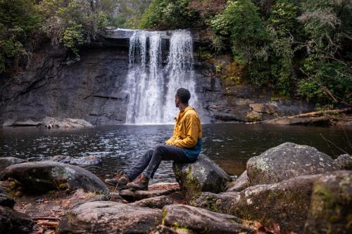 Person Admiring a waterfall