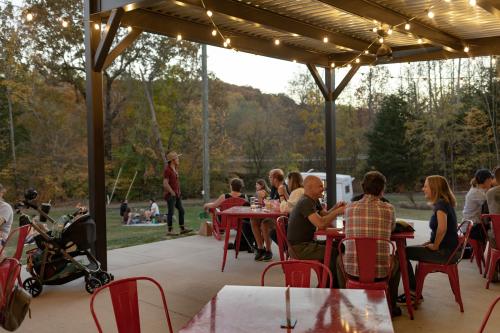 People Gathered on the Patio and Lawn at Eno River Brewing