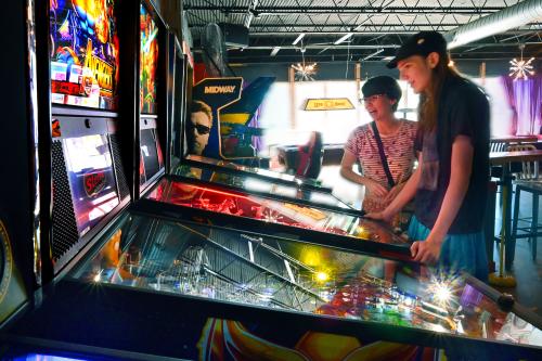 People Playing Pinball at The Baxter Arcade