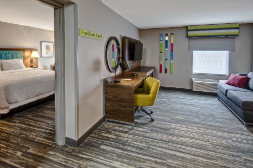 A view of a room and living room suite at the New Albany Best Western.