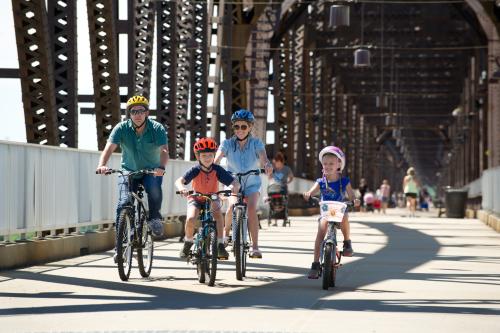 Family biking on the Big Four Bridge