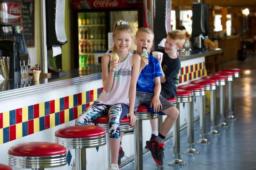 Kids eating ice cream cones at Joe Huber's Soda Shoppe Ice Cream