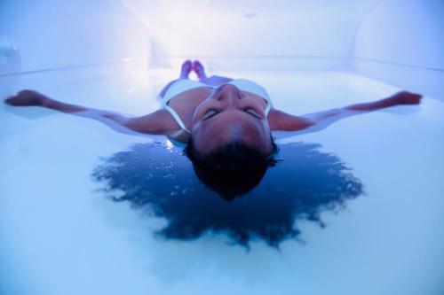 Woman floating in water at Sukhino Float