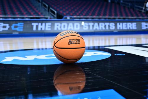 NCAA First Four promo photo showing a basketball on a court