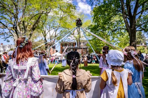 Maypole dancers dance in Colonial garb.