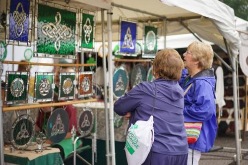 Women shopping Celtic knot stained glass at the Dublin Irish Festival