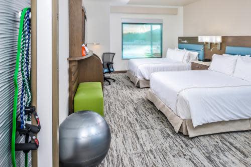 EVEN Hotel room courtesy of IHG Photo is of a clean, bright room with exercise equipment.