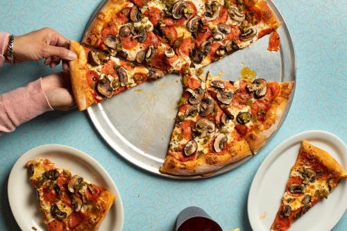 Pizza de Santa Rosa includes green chile, mushroom, and pepperoni.