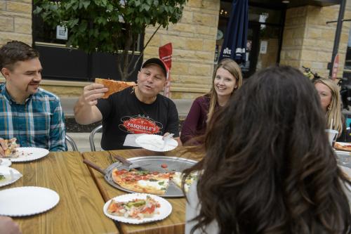 Pasquale Presa eating pizza