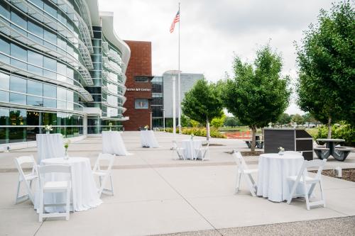 Riverfront Plaza set up with tables chairs and bar