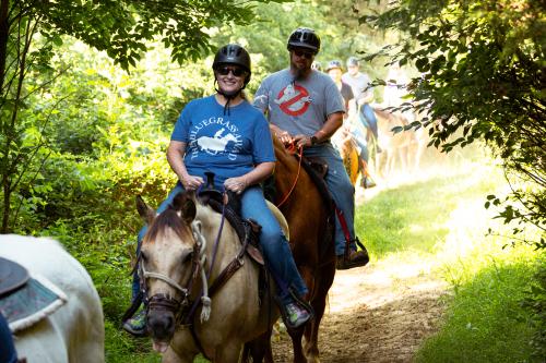 Two people horseback riding at Shelby Trails Park in Simpsonville, KY in ShelbyKY.