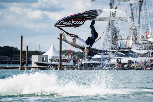 Man doing back flip on a jet ski at Southampton International Boat Show