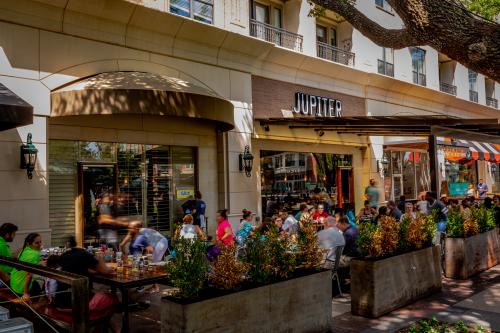 Outdoor patio full of people at Jupiter Pizza and Waffle Co.