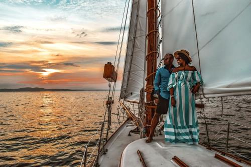 couple enjoys sunset on schooner on Lake Champlain